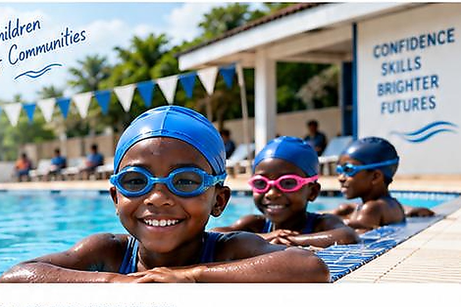 School children wearing swim caps with coach